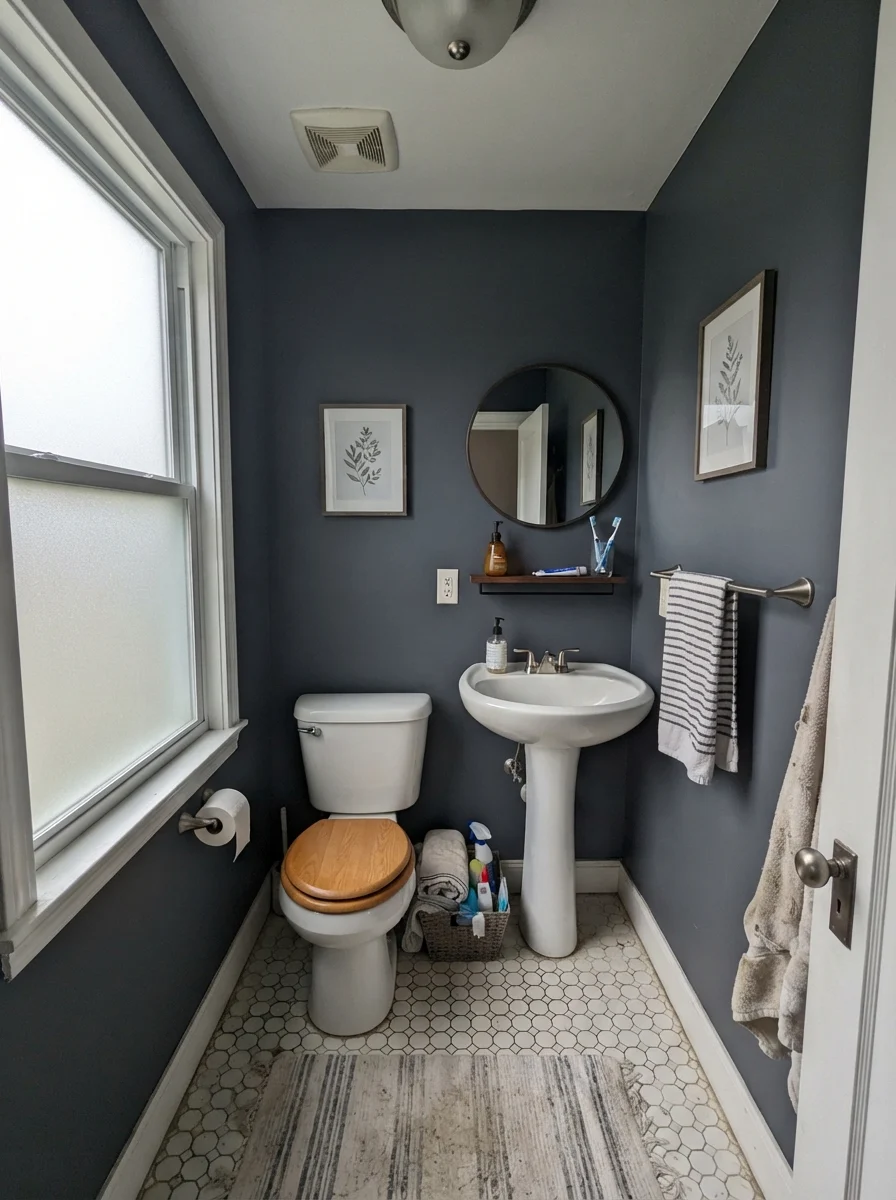Small bathroom with Hale Navy walls looking gray under overcast daylight through frosted glass.
