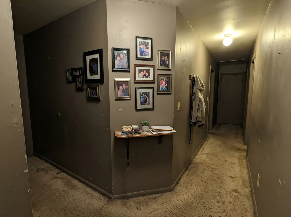 Dim windowless hallway corner where Porpoise looks flat, muddy and lifeless