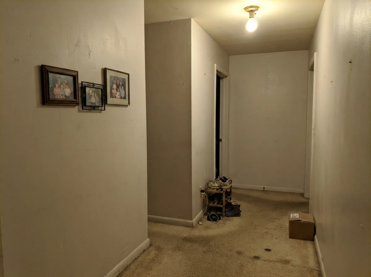 Dim windowless hallway showing Shoji White looking muddy and dull